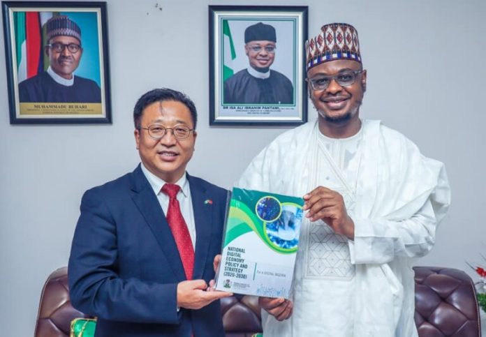 L-r: Cui Jianchun, Chinese ambassador to Nigeria receiving NDEPS document from Professor Isa Ali Ibrahim (Pantami), minister of Communications and Digital Economy