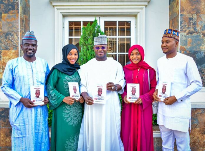 L-R: Publisher of PR Nigeria, Alhaji Yushau Shuaib, Governor Yahaya Bello of Kogi State and IMPR Staff