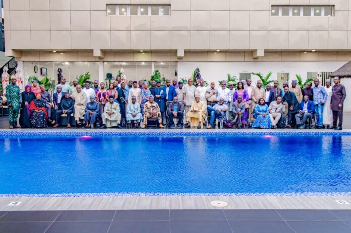 The Director General, NITDA, Kashifu Inuwa, CCIE with Directors, Head of units and other management staff of the agency in group photograph after the 2022 management retreat held in Lagos.
