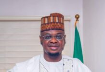 Buhari Confers ‘Digital Innovation Award’ on Pantami Pantami holding the award plaque he received from President Buhari