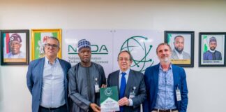 NITDA Boss Encourages Global Investors to Explore Nigeria’s Thriving Digital Market The Ambassador of Spain to Nigeria, Juan Sell, being presented with NITDA SRAP Documents by DG's Representative, Dr Usman Abdullahi Gambo, flanked by Reps of SEIDOR