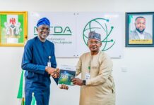 NITDA, FCT UBEB, Collaborate To Foster Digital Literacy In Schools DG rep., Director ITIS, Mr Oladejo Olawumi (left) presenting the agency's SRAP to the Ag. Chairman, FCT-UBEB, Dr Alhassan Sule (right)